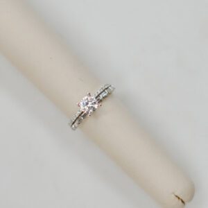 14kt White gold double band engagement ring with .37ctw of accent baguette and round Diamonds.
